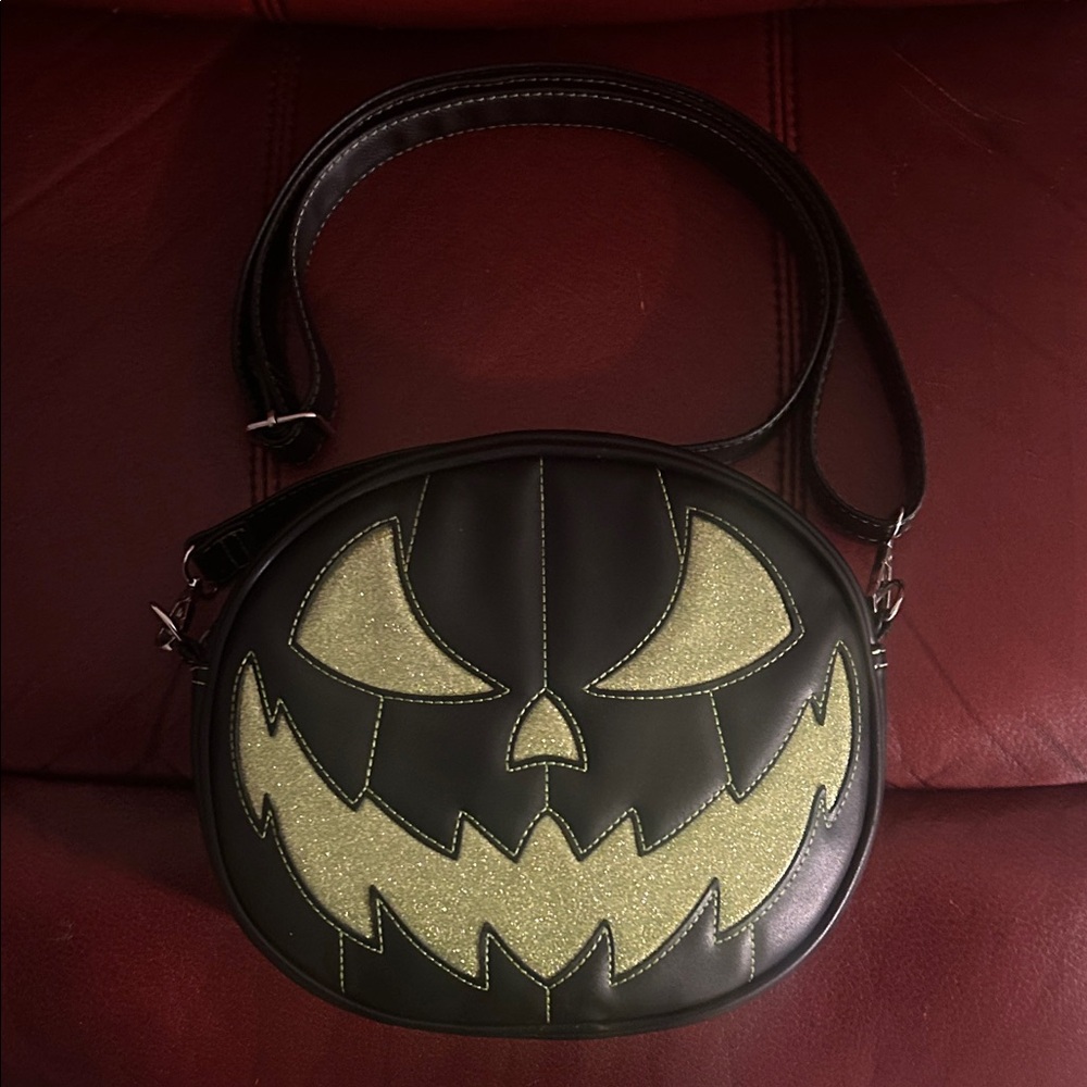 Love, Pain and Stitches black/green glitter pumpkin face crossbody bag